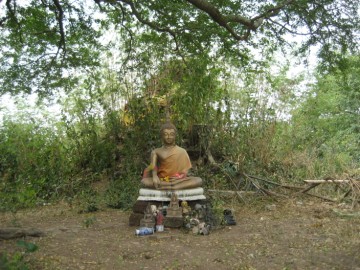 Buddha statue on a brick mound